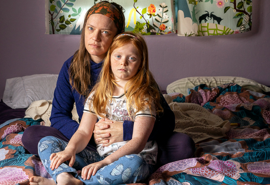 girl and mom on bed