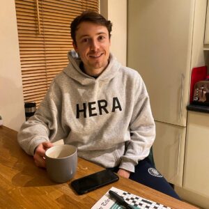 Jack Emmet with a cup of coffee in his hand