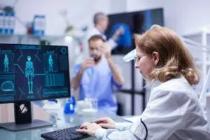 Woman working with computer in the office of a science laboratory