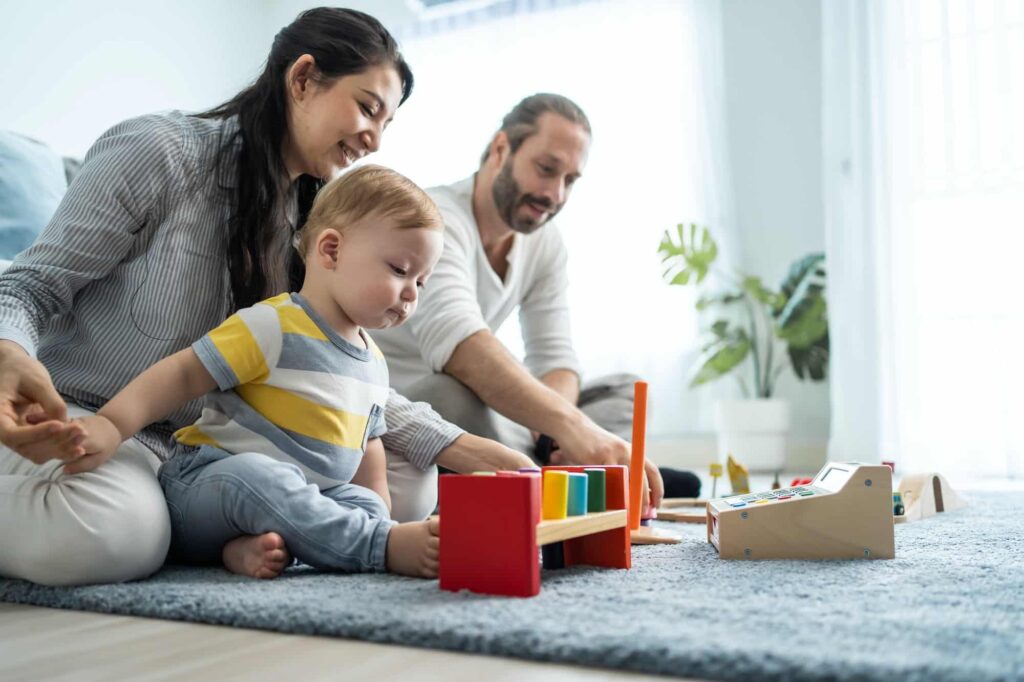 parents playing with a baby