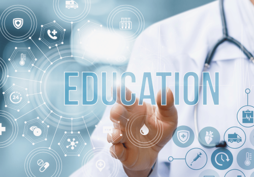 Medical professional pointing to the word Education