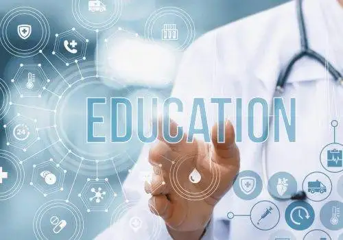 Medical professional pointing to the word Education